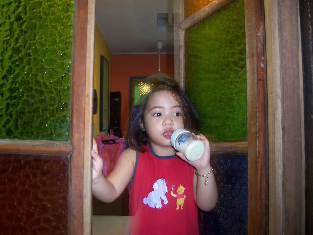 Brianna, Icka's nephew, who clings on her Dora doll, opens the radio, and speaks even better Filipino than our blockmate. Image hosted by Photobucket
