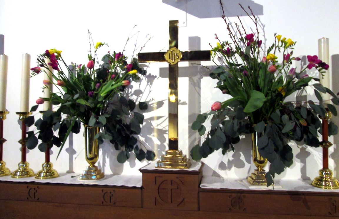 easter flowers, cross and candles