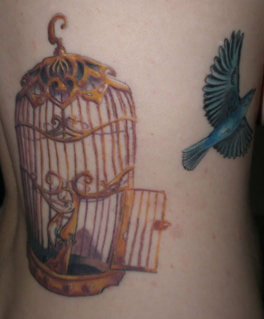 Unique tattoos, bird escaping from cage tattoo