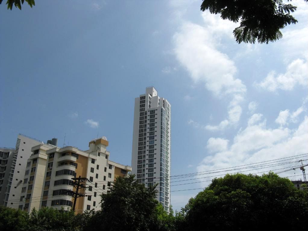 Photograph of an example of the many new building that have the shape of a big match box. They have no style and makes the citys appearance boring.