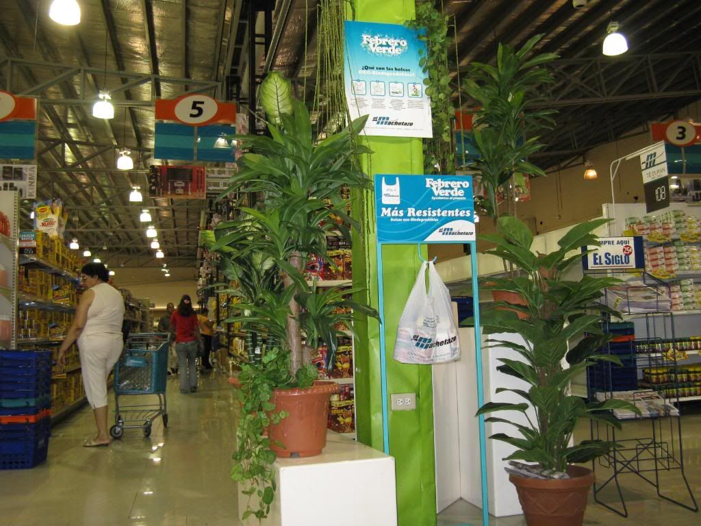 A green display promoting a new biodegradable plastic bag at El Machetazo supermarket.