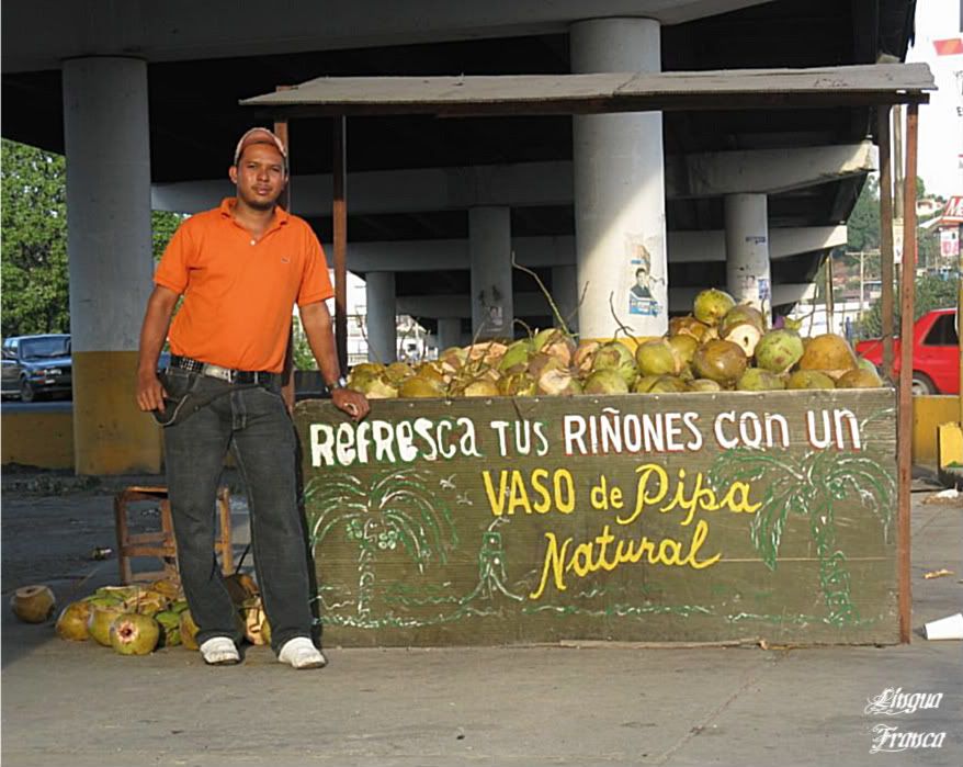 Photo of Cristian with a pile of empty coconuts at the end of a business day. (Credit: Omar Upegui R.)