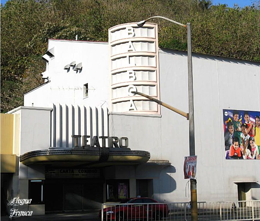 A closer view of the Balboa Theater. The poster at the right promotes the Canta Conmigo contest held every Wednesday evening. The hill on the background is Sosa Hill. (Credit: Omar Upegui R.)