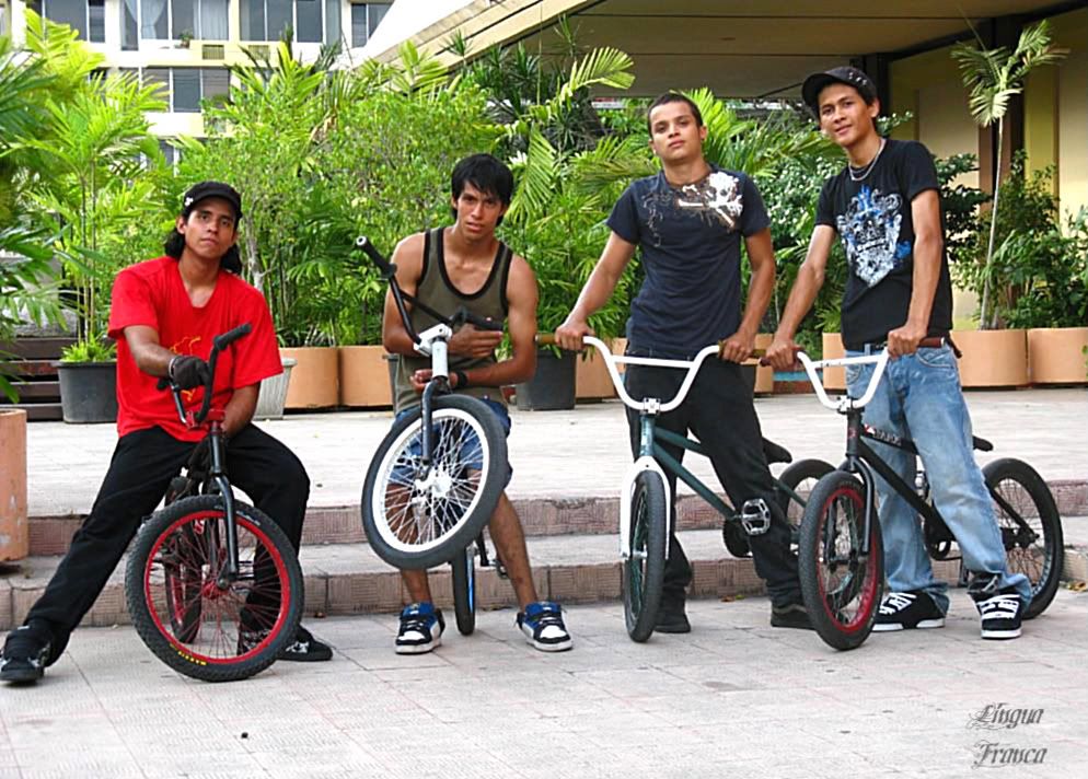 A group of four youngsters practicing their bicycle stunts at the Flags Square of the Atlapa Convention Center, Panama City, Panama. (Credit: Omar Upegui R.)