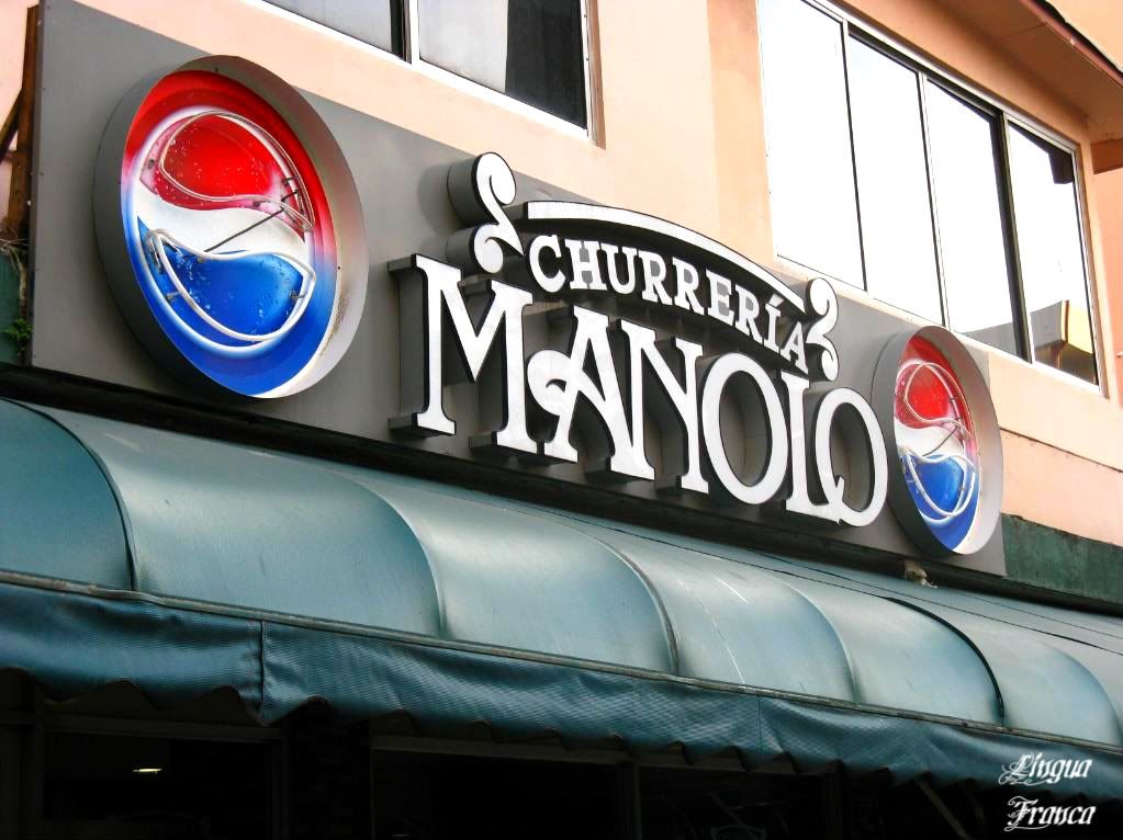 Photograph of the exterior sign of Churrería Manolo at Via Argentina in Panama City, Panama. (Credit: Omar Upegui R.)