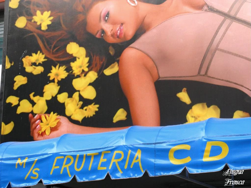 Betcha the owner of the fruit shop was taking advantage of the photograph of the beautifu woman above to promote his business. I would. (Credit: Omar Upegui R.)