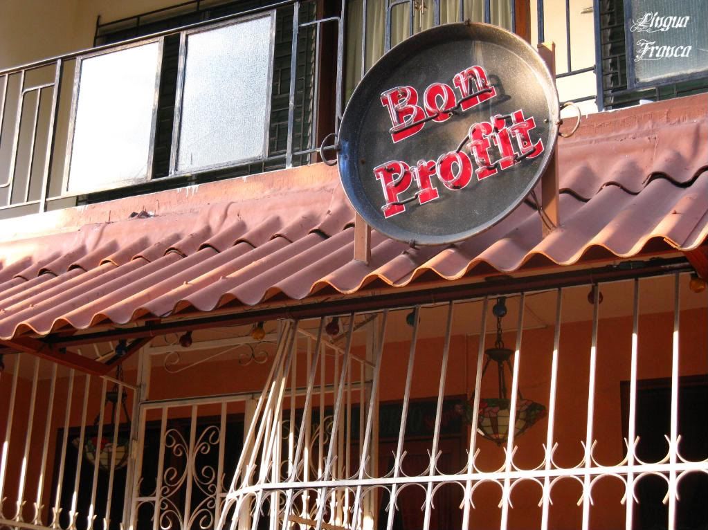 A closer look at the sign of the Bon Profit Restaurant. If you look closely, you will notice that the sign is a round frying pan. (Credit: Omar Upegui R.)