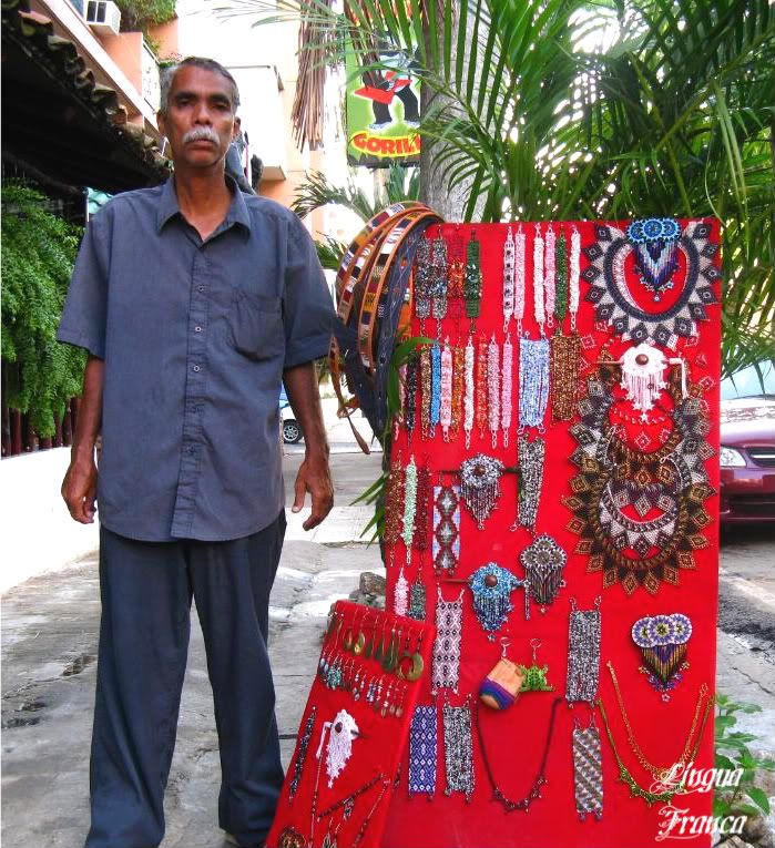 Photograph of the street peddler and his assortments of Guatemalan handicrafts. (Credit: Omar Upegui R.)