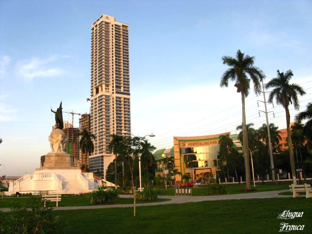 Phototograph of the statue of Vasco Nuñez de Balboa towards your left, almost drowned by the new modern buildings in Panama City, Panama. (Credit: Omar Upegui R.)