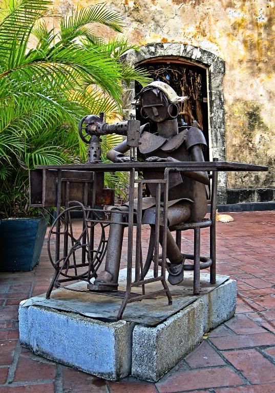 Photograph of a metallic lady and her sewing machine located at Las Bóvedas in the Casco Viejo of Panama City, Panama.